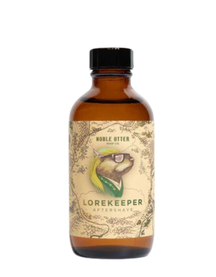 Amber glass bottle of Noble Otter Lorekeeper Aftershave with a detailed label featuring a unicorn-owl hybrid wearing glasses, green bandana, and blonde hair, in a vintage style