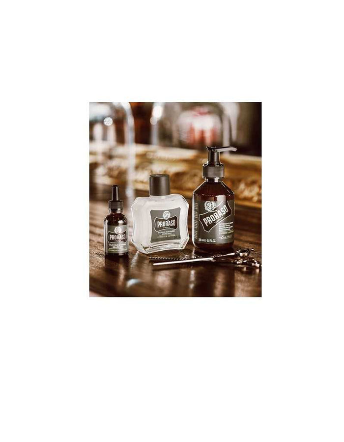Proraso beard grooming oils and lotion bottles on wooden surface