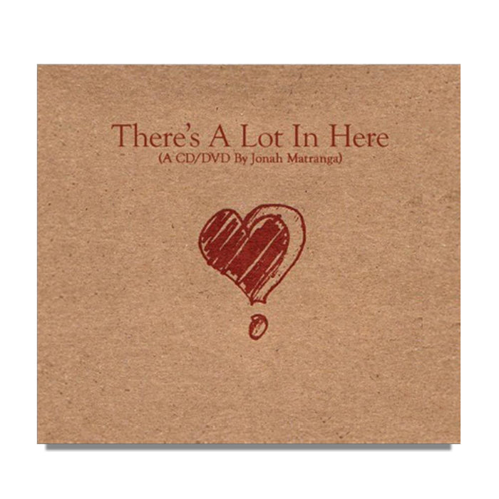 Brown cardboard CD/DVD cover from Jonah Matranga features a red, hand-drawn heart with a drop below and the text “There’s A Lot In Here (A CD/DVD By Jonah Matranga)” above, reflecting his heartfelt style.