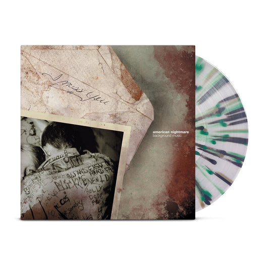 American Nightmare - 'Background Music' LP. A vinyl record is shown against a white background. The cover has a teal and rust background, and on it, a cream-colored envelope with "I miss you" written on it and a photograph of a person in a jean jacket with a girl's head peeking over their shoulder. Next to the envelope are the words "american nightmare" and "background music" in small white letters. There is a vinyl record next to the cover. It is clear with green, gold, and black stripes and do