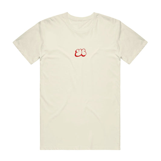 Cream colored t shirt with YC written in the middle of the shirt in small red letters.