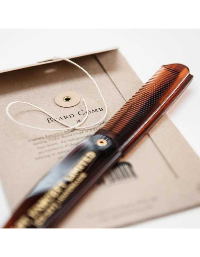 Beard comb in packaging with branding and instructions