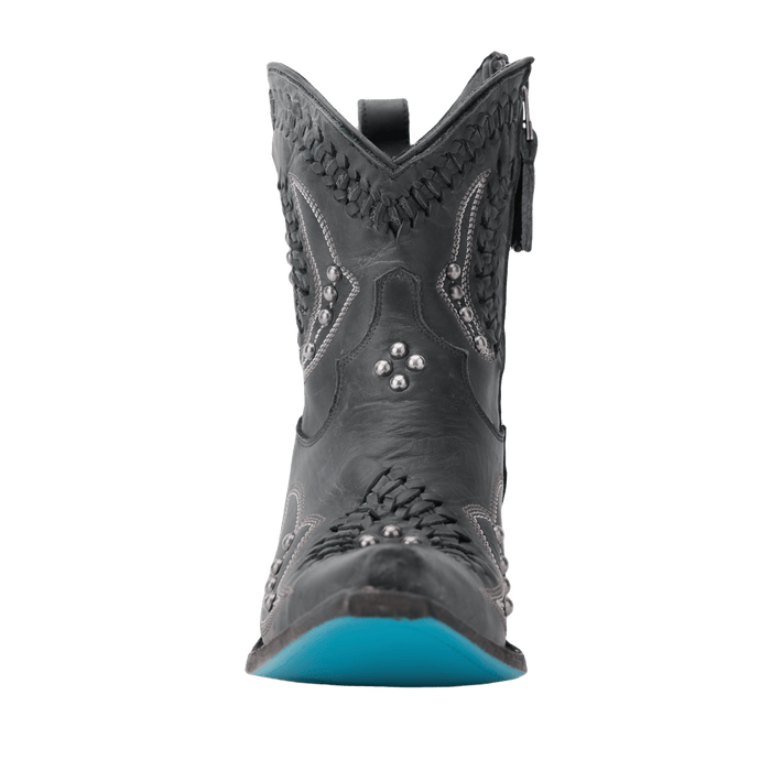Distressed jet black Cossette bootie with turquoise sole.