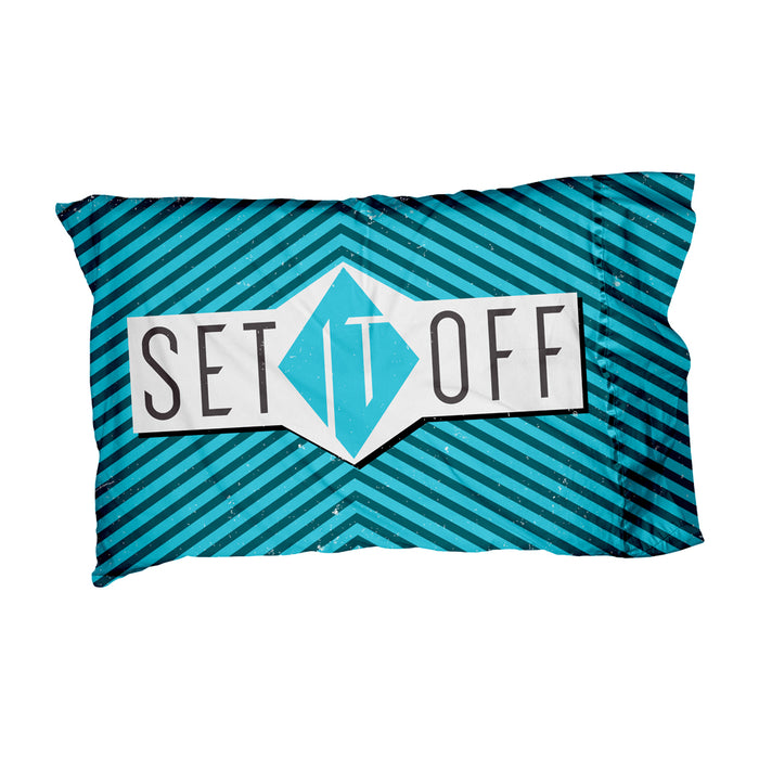 A Set It Off logo pillowcase with blue and black diagonal stripes and “SET IT OFF” boldly printed over a central geometric diamond.