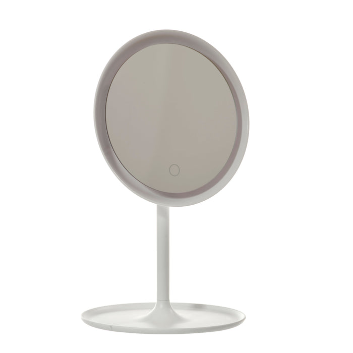Danielle Creations Round LED Backlit Mirror on white pedestal stand with circular tray base, touch button, white background.
