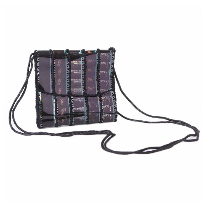 Handbag with a patterned design on a white background