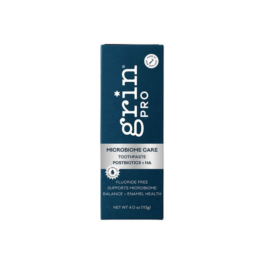 Grin Pro Microbiome Care Toothpaste 113g in dark teal box with silver band, reading "Postbiotics + HA, Fluoride Free" on white background.