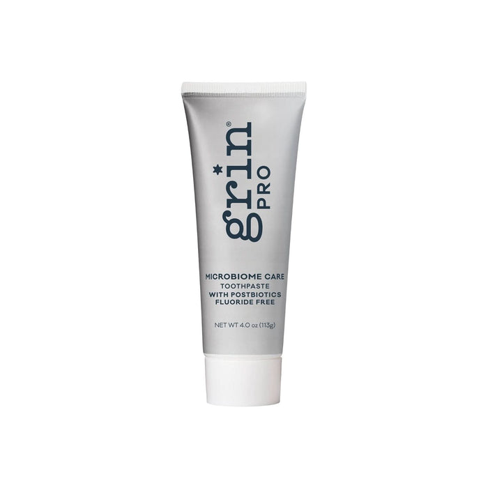 Grin Pro Microbiome Care Toothpaste 113g silver tube with white cap on white background, labeled fluoride free with postbiotics, 4oz