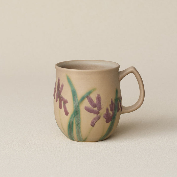 Hand-thrown ceramic mug by Rookwood Pottery