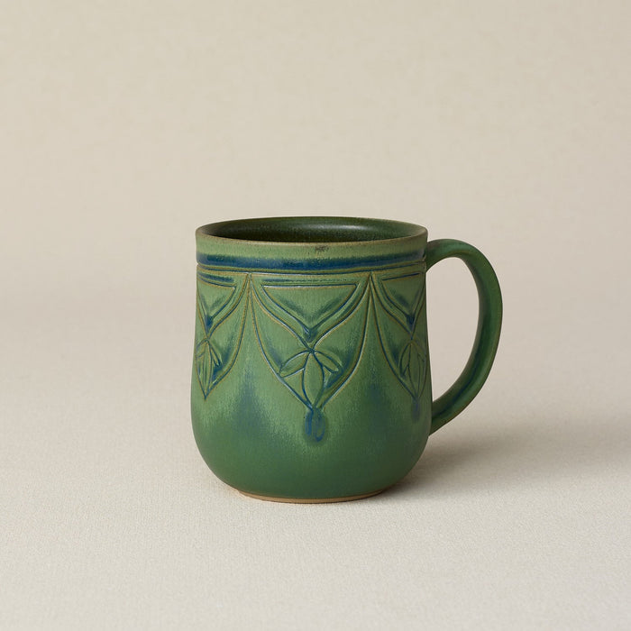Hand-thrown ceramic mug by Rookwood Pottery