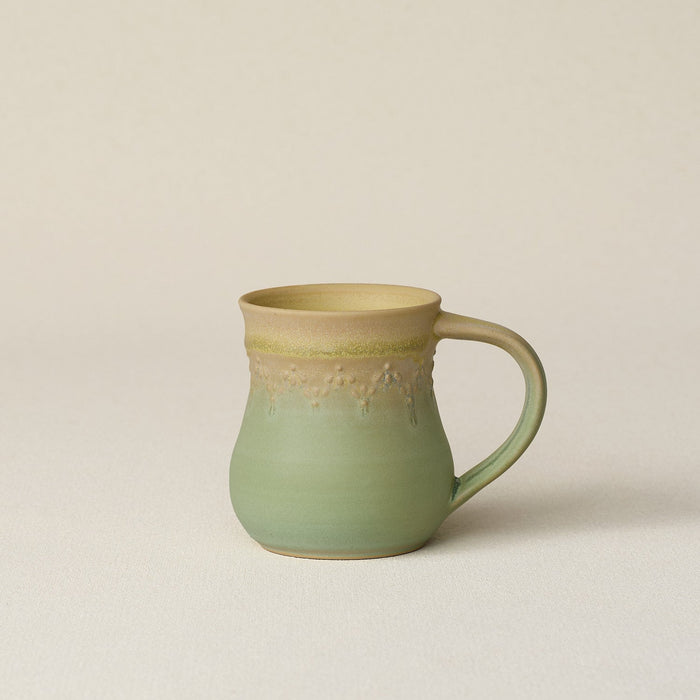 Hand-thrown ceramic mug by Rookwood Pottery