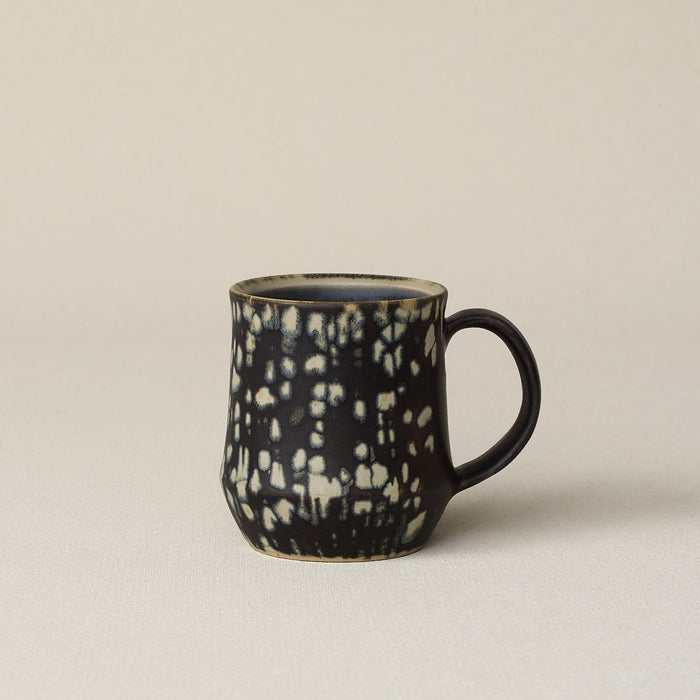 Hand-thrown ceramic mug by Rookwood Pottery