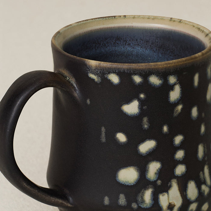 Close-up details of hand-thrown mug by Rookwood
