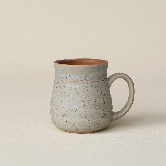 Hand-thrown ceramic mug by Rookwood Pottery