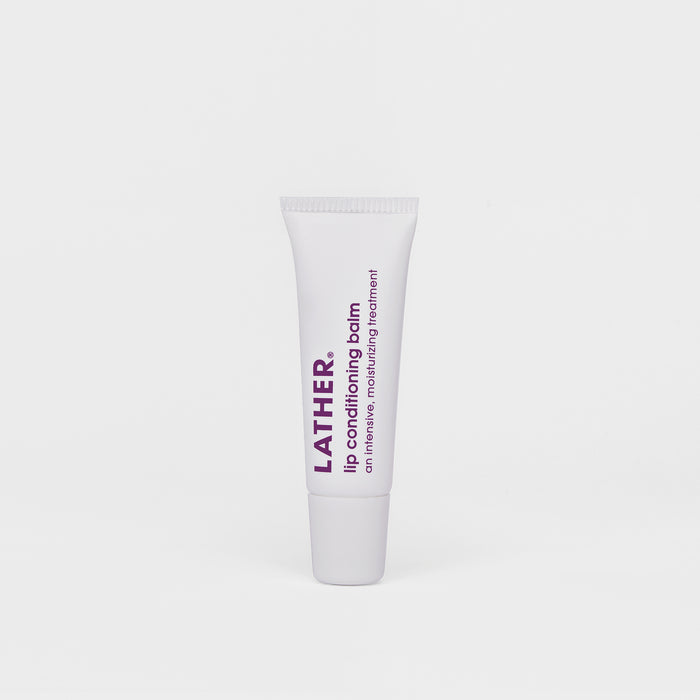 A tube of LATHER Lip Conditioning Balm against a white background.