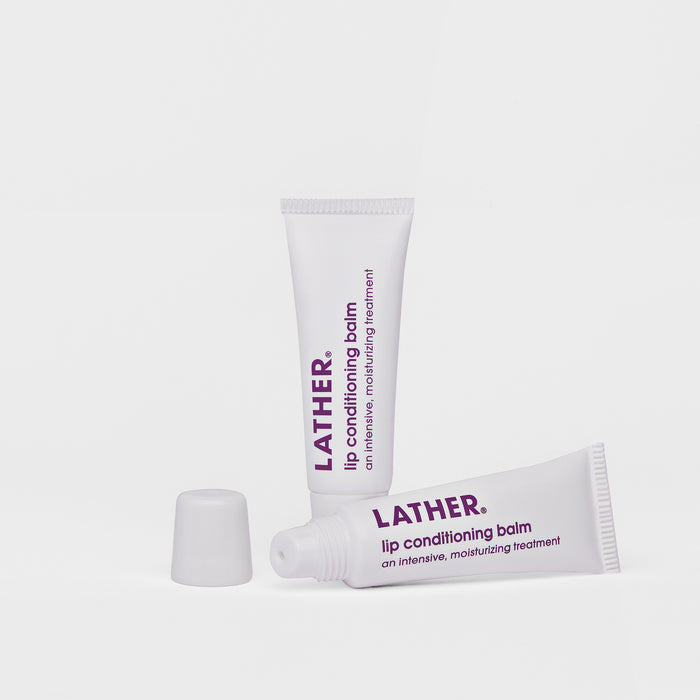 Two tubes of LATHER Lip Conditioning Balm against a white background.