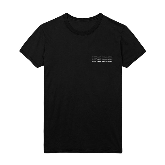 Front of black short sleeve shirt with text that says EVERY SCAR HAS A STORY in white text in the top corner, written 3 times stacked on top of one another.