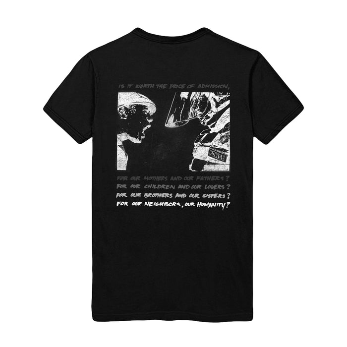 On the back, there is a drawing of a boy yelling in the face of a police officer that is much taller than him. Below that drawing is more text that is stacked in gradient coloring, getting more visible toward the bottom of the shirt.