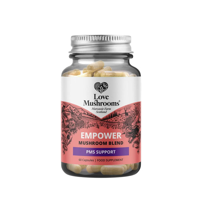 Love Mushrooms Empower PMS GO 60 Capsules glass jar with silver lid, pink label reading "Empower Mushroom Blend PMS Support", white background.