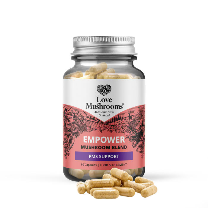 Love Mushrooms Empower PMS GO 60 Capsules glass jar with silver lid, pink label reading "Empower Mushroom Blend PMS Support", white background.