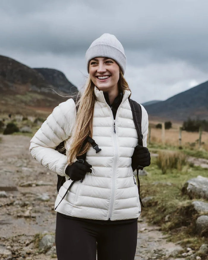 Ivory coloured Mac In A Sac Womens Synergy Jacket on blurry mountain background #colour_ivory