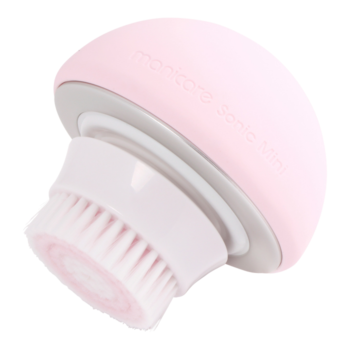 Side profile of Manicare Sonic Mini rechargeable facial cleansing brush with ergonomic handle and waterproof brush head