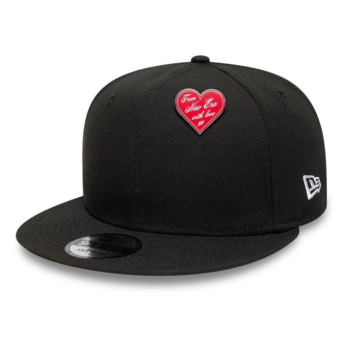 Pictured is this New Era Heart Script Pin Badge in silver. 2