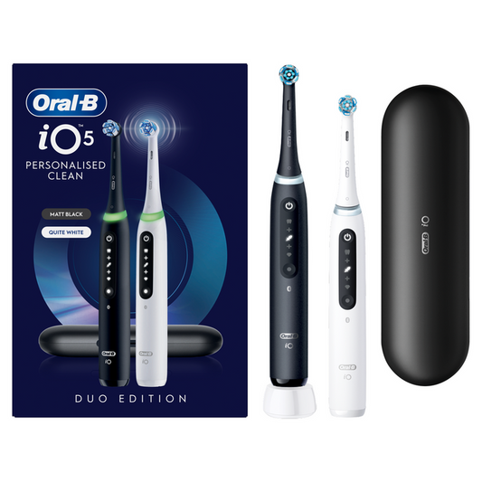 Oral-B iO5 Duo Edition 2-pack box, black and white electric toothbrushes with brush heads and black travel case on white background.