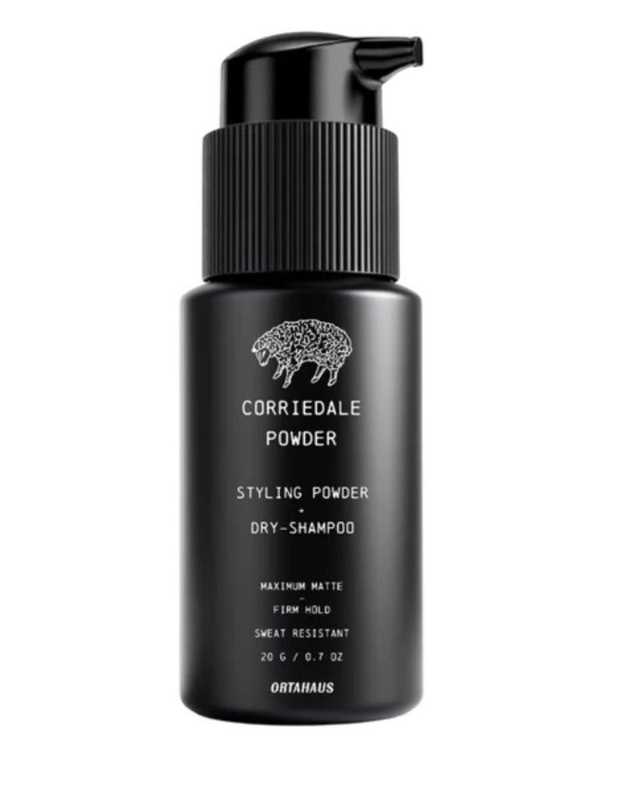 OrtaHaus Corriedale Powder, a sweat resistant volumizing hair powder for texture and matte hold. Absorbs oil for all day control. In a black bottle.