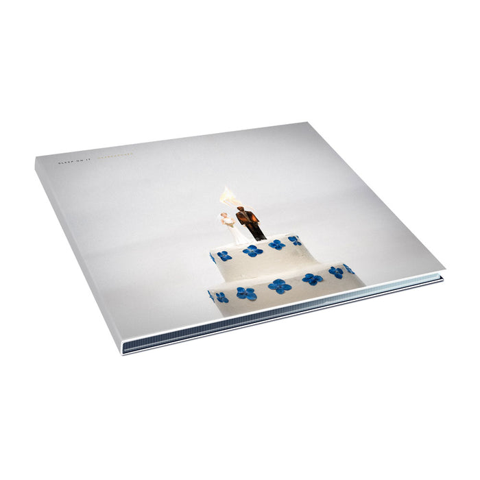 CD with artwork of a weeding cage where the bride and the groom on top of the cake are on fire.