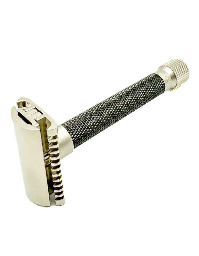 Close-up of safety razor with textured handle and chrome finish