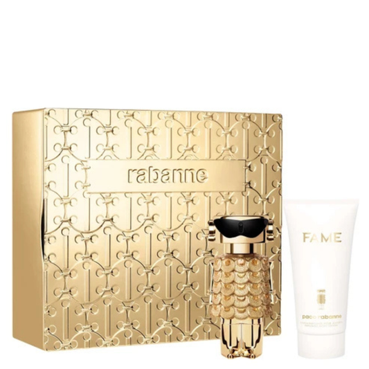Rabanne Fame Intense gift set on white background: gold embossed box, gold EDP bottle, white body lotion tube labelled "FAME"