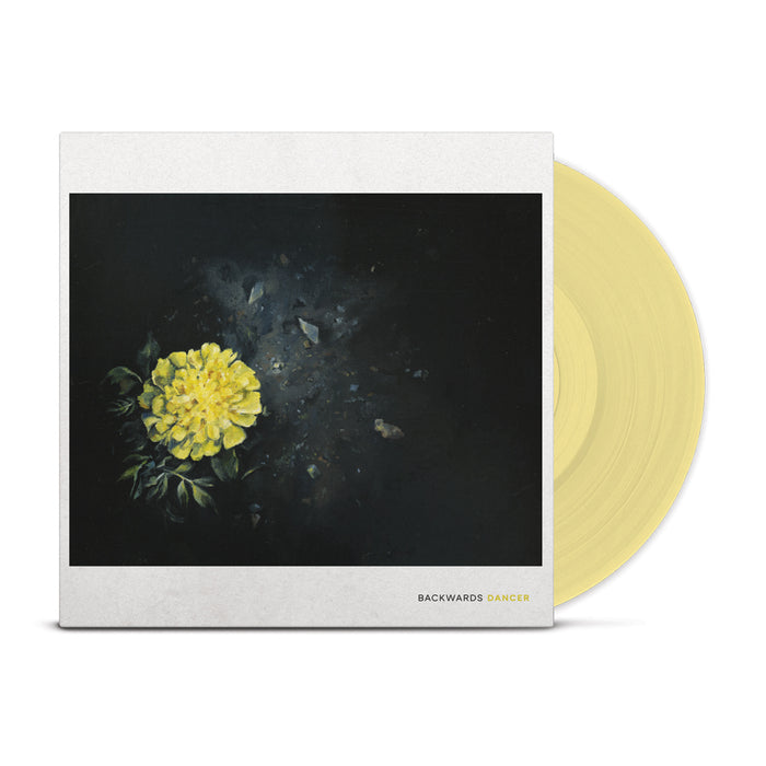 A pale yellow Backwards Dancer self-titled vinyl slides out of an album cover with a yellow flower on a dark background. The cover reads BACKWARDS DANCER. This limited edition LP is in stock now. Brand: Backwards Dancer.