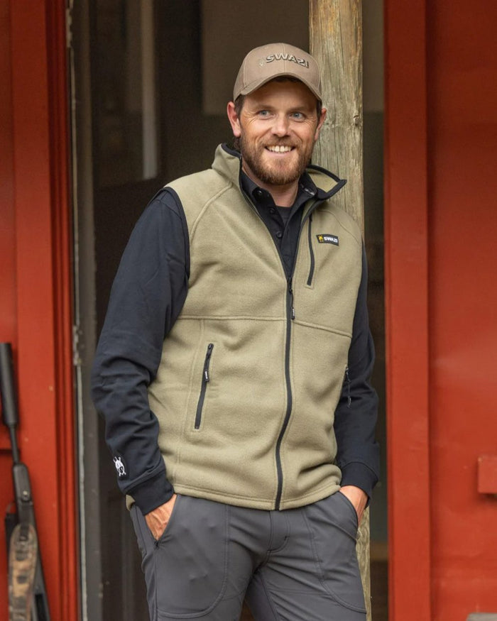 Tussock Coloured Swazi Sherpa Vest on door background #colour_tussock