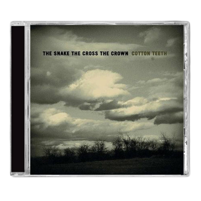 A CD case featuring a cloudy sky over a bleak landscape with THE SNAKE THE CROSS THE CROWN COTTON TEETH in bold uppercase, reflecting the brands moody, atmospheric rock style.