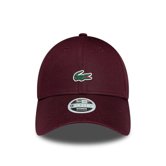 Pictured is this Womens Lacoste X New Era 9FORTY cap in dark purple. 2