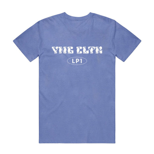 Periwinkle short sleeve shirt with "YNG CLTR" written across the chest in white bubble lettering. Below that is an oval, and inside "LP1" is written.